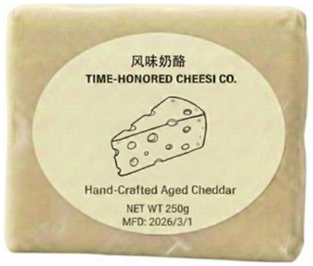 A package of hand-crafted aged cheddar cheese.