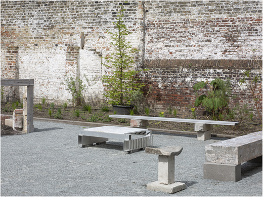 A garden furniture set made from stone, concrete, brick fragments, and aluminum profiles.