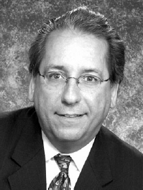 A photograph of John G. Flores.