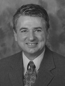 A photograph of Tom Land.