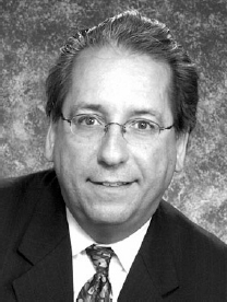 A photograph of John G. Flores.