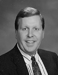 A photograph of Michael Corry.