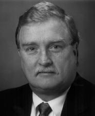 A profile box with a portrait showing the face obscured and text listing Michael J. Hannafin s name, titles, university, department, address, telephone, and email.