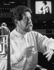 A profile box shows David Stuart s name, title, university, telephone number, and email below a portrait with his face obscured, a trombone, and audio equipment in the background.