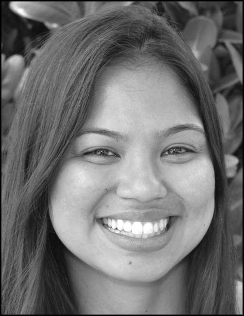A photograph of Sheila Y. Grangeiro.