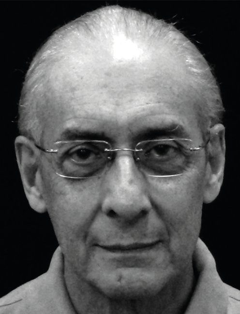 Older man with glasses looks forward, head framed by a dark background. Labelled, Rafael Giraldo, Doctoral Student, Nova Southeastern University.