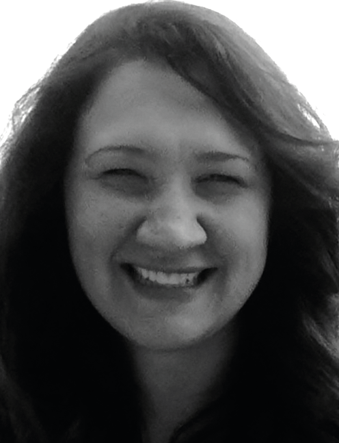 Woman with long hair smiles, facing forward against a plain background. Labelled, Marilyn A. Goodrich, Training and Consultation.