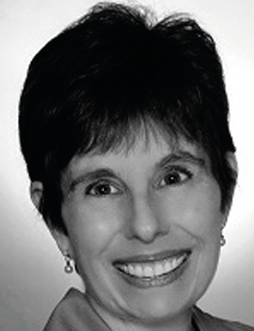 Smiling woman with short hair, earrings, and a plain background. Labelled, Wendy Conaway, Ashford University.