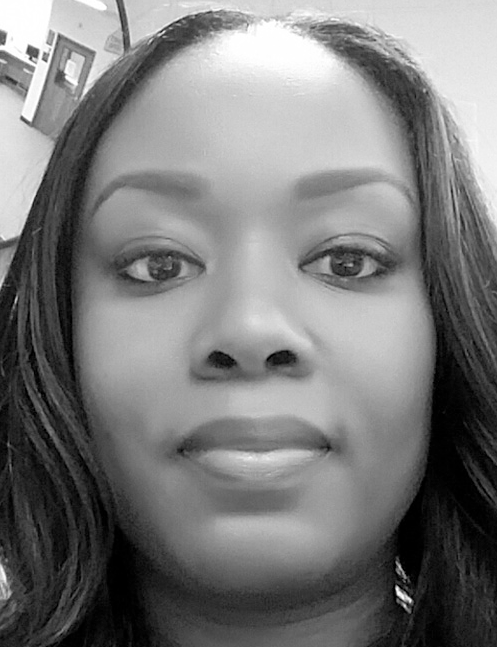 Woman with dark hair looks directly forward in a close up portrait. Labelled, Charlyque Joy Harris, Technology Education and Engineering Teacher, J. E. Richards Middle School.