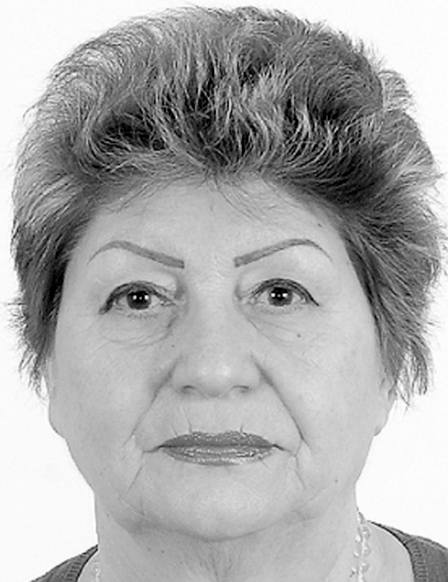 Older woman gazes directly forward, headshot, short hair, simple background. Labelled, Varvara Gasparyan, 12 Fortini St Apt.