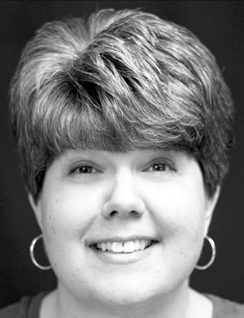 Smiling woman with short hair and hoop earrings poses for a headshot. Labelled, Wendy Robichaud, Teacher, Oxford Hills Technical School.