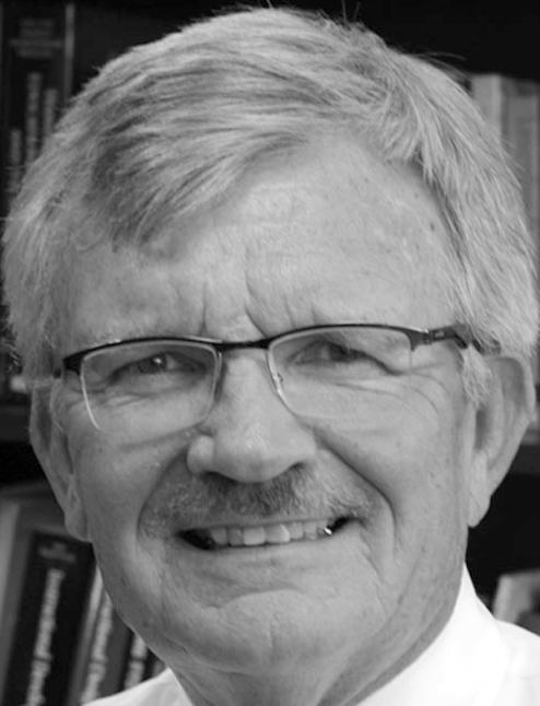 A portrait of Michael Simonson with text listing his role as Editor and Program Professor at Nova Southeastern University, address, phone, and email.