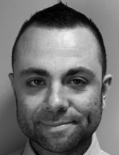 A portrait of Christopher Voltmer with text listing his role at Touro College, address in Bay Shore New York, phone, and email.