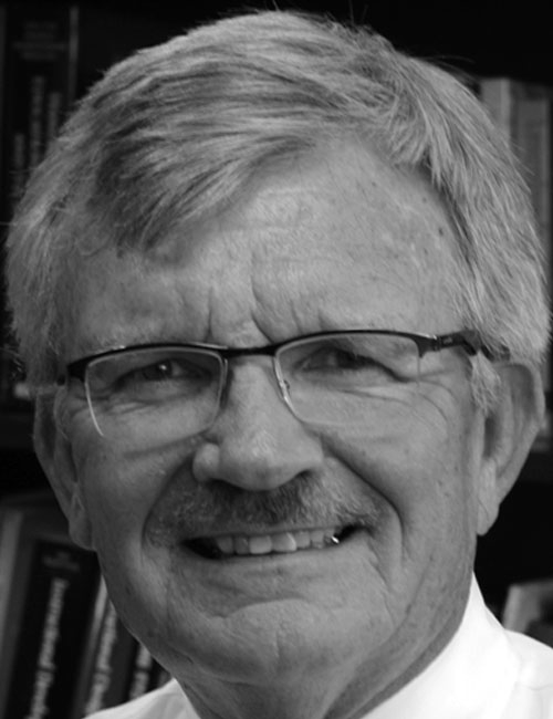 A headshot of Michael Simonson smiling, with professional contact details below.