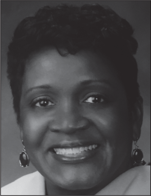 A portrait of Kathyleen Gamble Wyatt smiling, with her name, title, and email listed below.