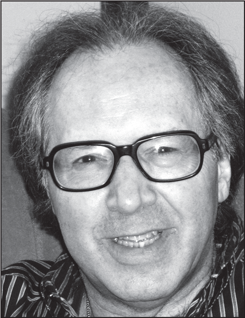 A portrait of Errol Craig Sull smiling, with his name, title, institution, and contact details below.