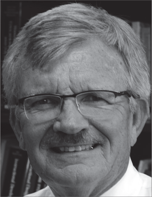 A portrait of Michael Simonson smiling, with his name, title, institution, and contact details below.
