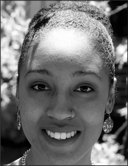 A portrait of Aja Stevens with contact information for the University of Lynchburg.