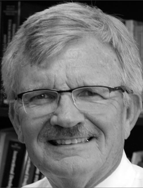 A portrait of Michael Simonson with contact information for Nova Southeastern University Fischler School of Education.