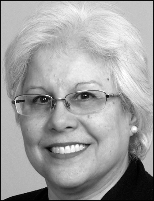 A black and white photograph of a man with contact information.She is a woman with short graying hair wearing glasses and smiling gently.
