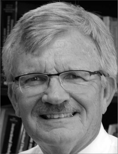 A black and white headshot of Michael Simonson an editor and professor at Nova Southeastern University.