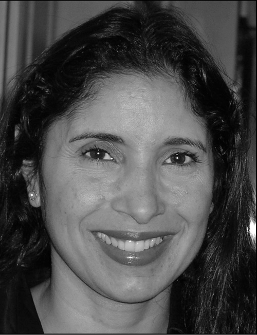 A professional black and white headshot of Natalie B Milman with her name and contact information.