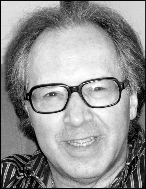 A professional black and white headshot of Errol Craig Sull with his name and contact information.