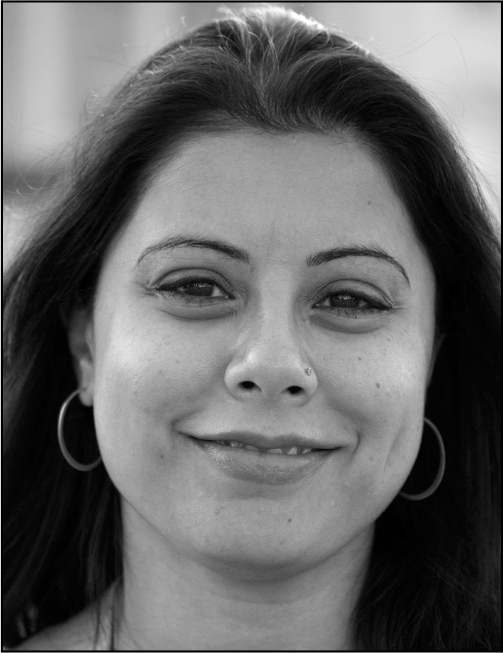 A woman with hoop earrings and long hair appears above contact information for Sarika S Gupta at Hunter College CUNY New York.