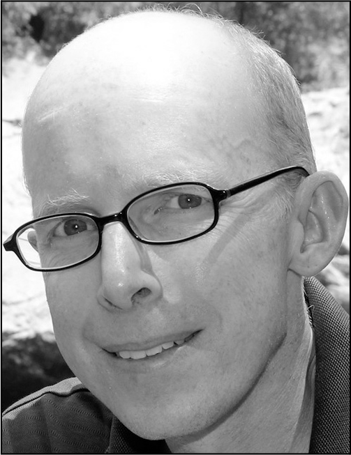 A portrait of Ryan Watkins.