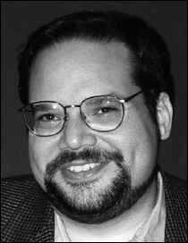 A headshot of Craig Ullman, Partner at Networked Politics, with his office address, phone number, and email.