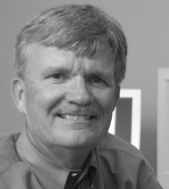A portrait photo with the face obscured above contact information for Michael Simonson, editor at Nova Southeastern University, including phone and email details.
