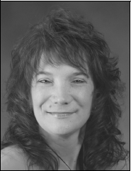 A black and white portrait of a woman with long hair, showcasing her elegant profile and calm demeanor.