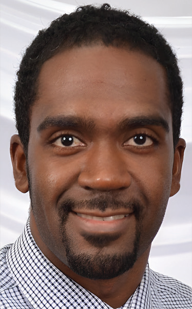 Headshot photograph of Dauran McNeil smiling, wearing a checkered shirt, with a light background. Text below identifies him as Southern Illinois University, with email dauran.mcneil@siu.edu.