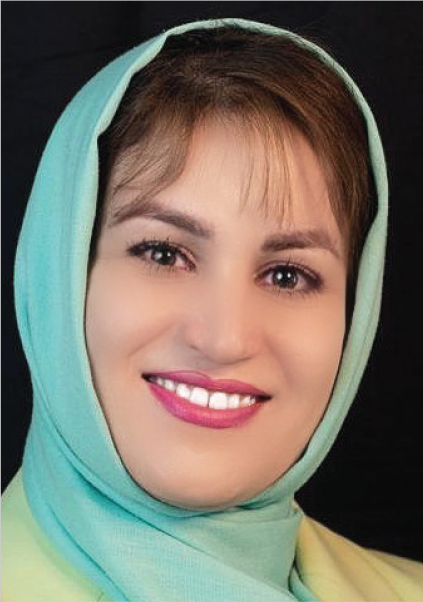 Hoda Harati wearing a light green hijab and smiling, identified with Towson University.
