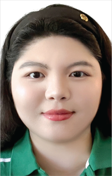 Yingying Liu with dark hair, wearing a green shirt, identified with Towson University.