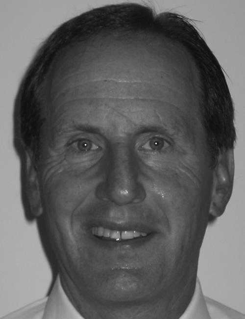 A grayscale portrait of a man above printed text listing his name, job title, university affiliation, mailing address, telephone number, and email.