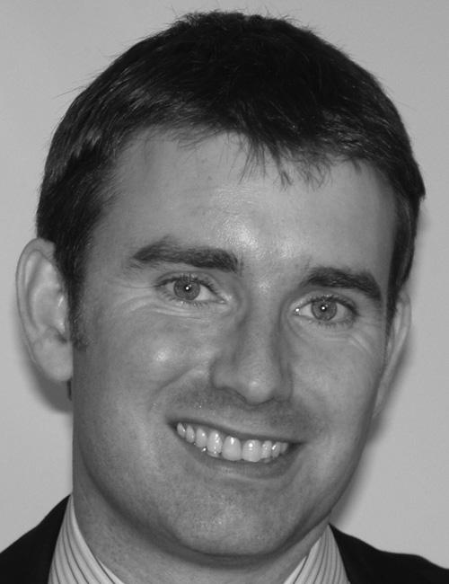 A grayscale portrait of a man above printed text listing his name, company affiliation, mailing address, telephone number, email, and website.