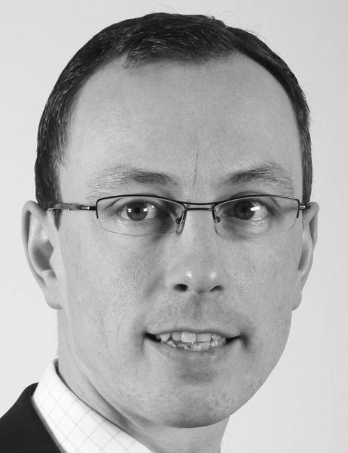 A grayscale portrait of a man above printed text listing his name, company affiliation, mailing address, telephone number, email, and website.