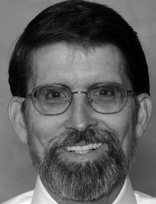 A portrait of a man above a text box listing a university contact with title, institution, address, telephone number, and email.