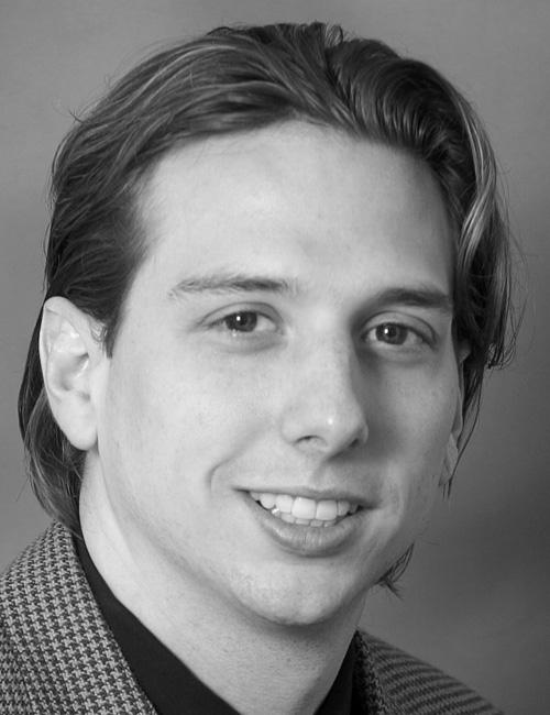 A portrait of a man above a text box listing a university contact with title, institution, address, telephone number, and email.