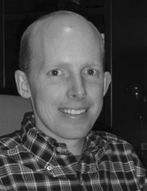 A portrait of a man above a text box listing a university contact with name, title, institution, and website.