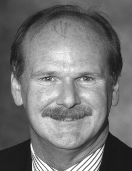 Black and white photo and contact info for Don Olcott, Jr., Chief Executive of OBHE and Chairman of USDLA; includes phone number and email, relevant to higher education and distance learning leadership.