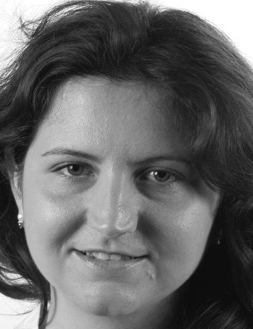 Black and white photo of Giulia Calvani, smiling, with text listing her address in Rome, Italy, phone number, and email contact for professional or business purposes.