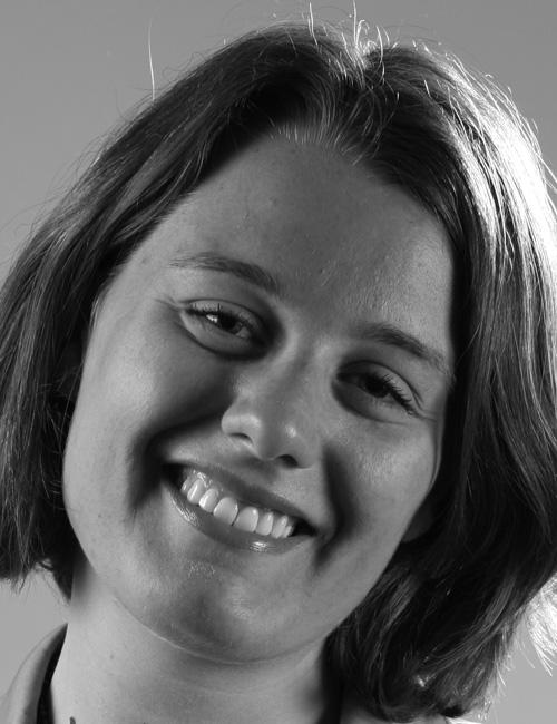 Black and white photo of Paola Rochira, smiling, with contact info below including Rome address, phone number, and email.