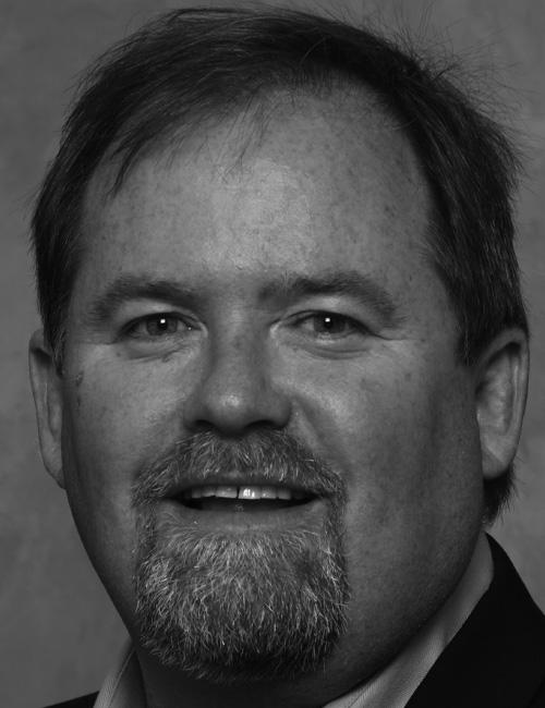 Business card with headshot of Rob Kilroy and contact info for USA iDirect Technologies, including address in Herndon, VA, phone number, email, and website.