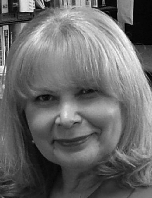 Black and white photo of Mildred Roqueta with contact info below, showing her affiliation with Miami Dade College in Florida.