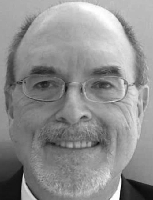 Black and white photo of Tom Clark, President of TA Consulting. His email contact is listed below the image.
