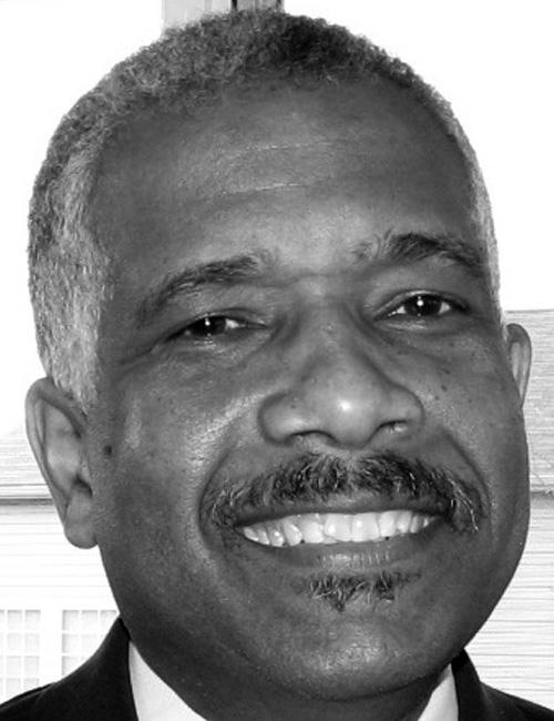 Photo of Ezra E. Hill, Jr., a Technology Staff Associate for Baltimore City Public Schools. His phone number and email are listed.