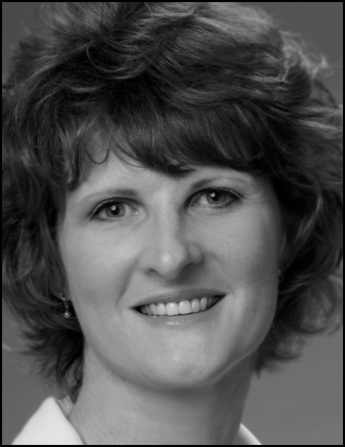 A black and white headshot and contact information for Kaye Shelton, Dean of Online Education at Dallas Baptist University.