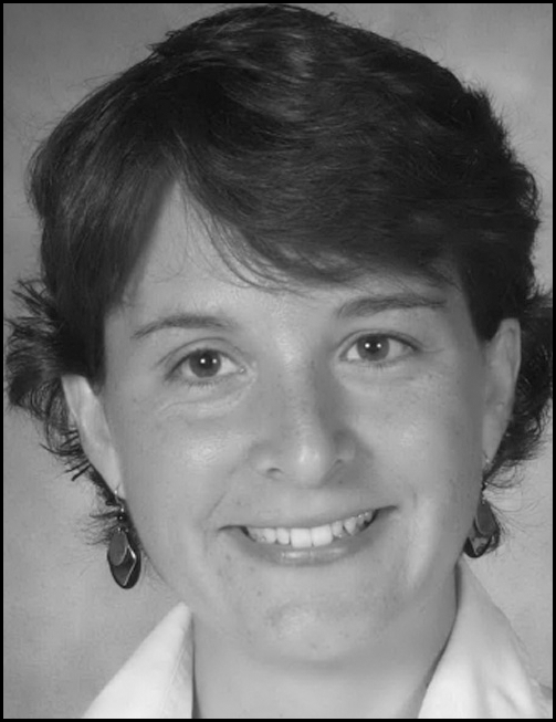 A black and white picture of a smiling woman named Sherry Marotte-Newman.